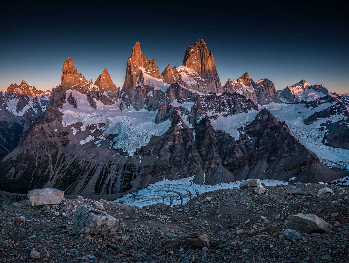 Jagged granite mountain peaks glowing in morning light